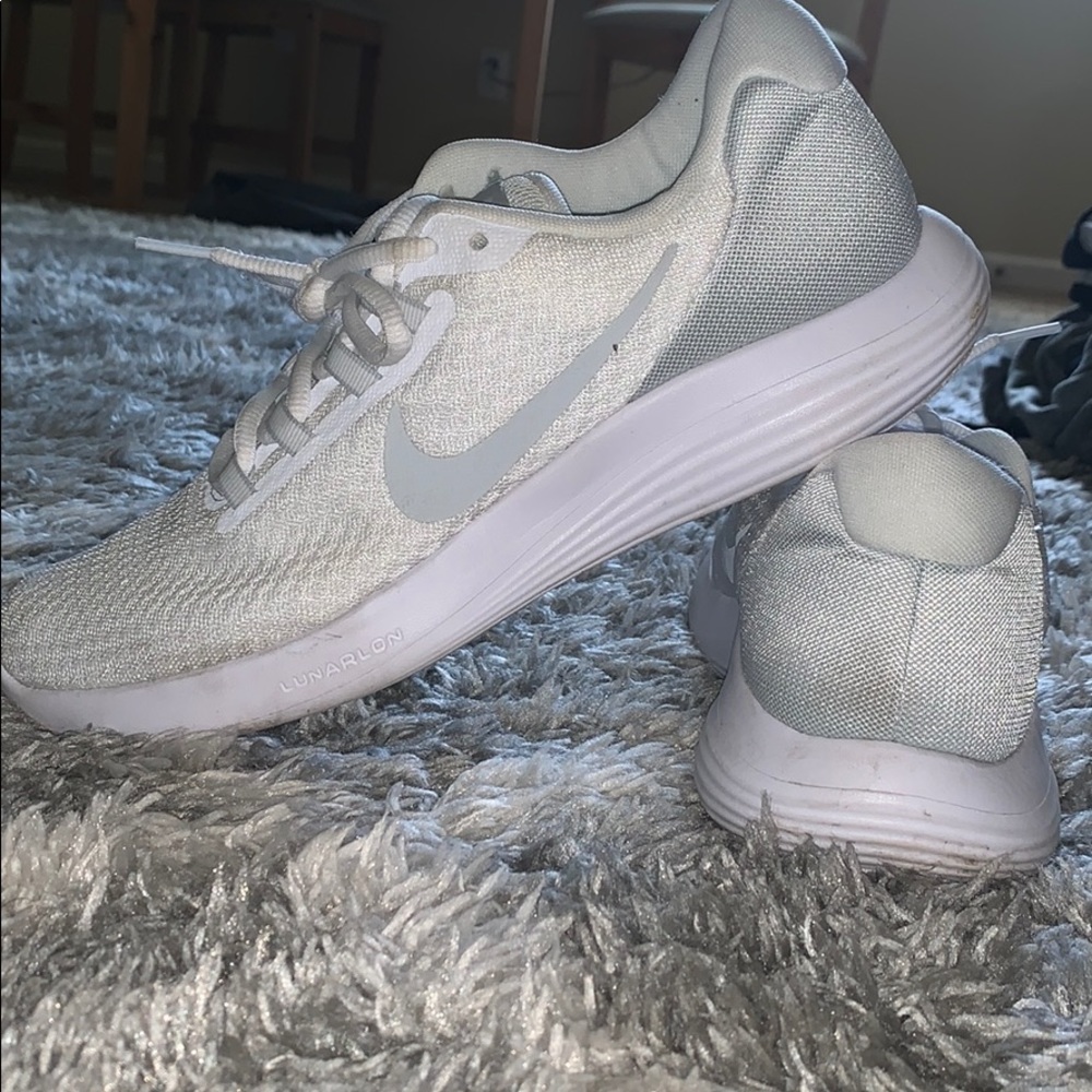 White Nike running shoes